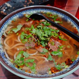 Shan Shan Noodles signature dishes Scallion Pancake
Fried Pork Buns
Braised Beef Noodles Soup